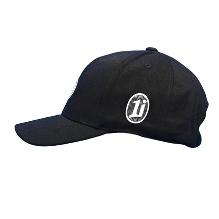 The 1i Golf Logo adorns the black Flexfit 110® Pro-formance® cap